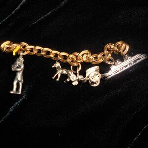 Three Vintage Charms - one sterling